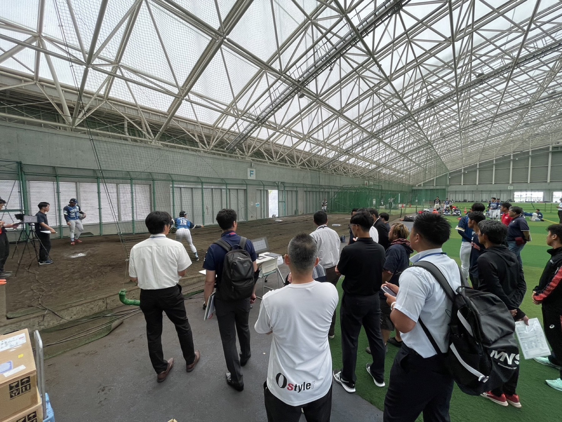 Professional baseball scouts observing the assessment event
